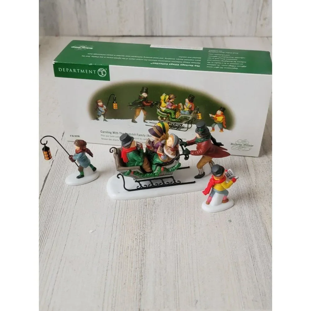 Dept 56 58396 Caroling With The Cratchit Family (Revisited) village accessory xm